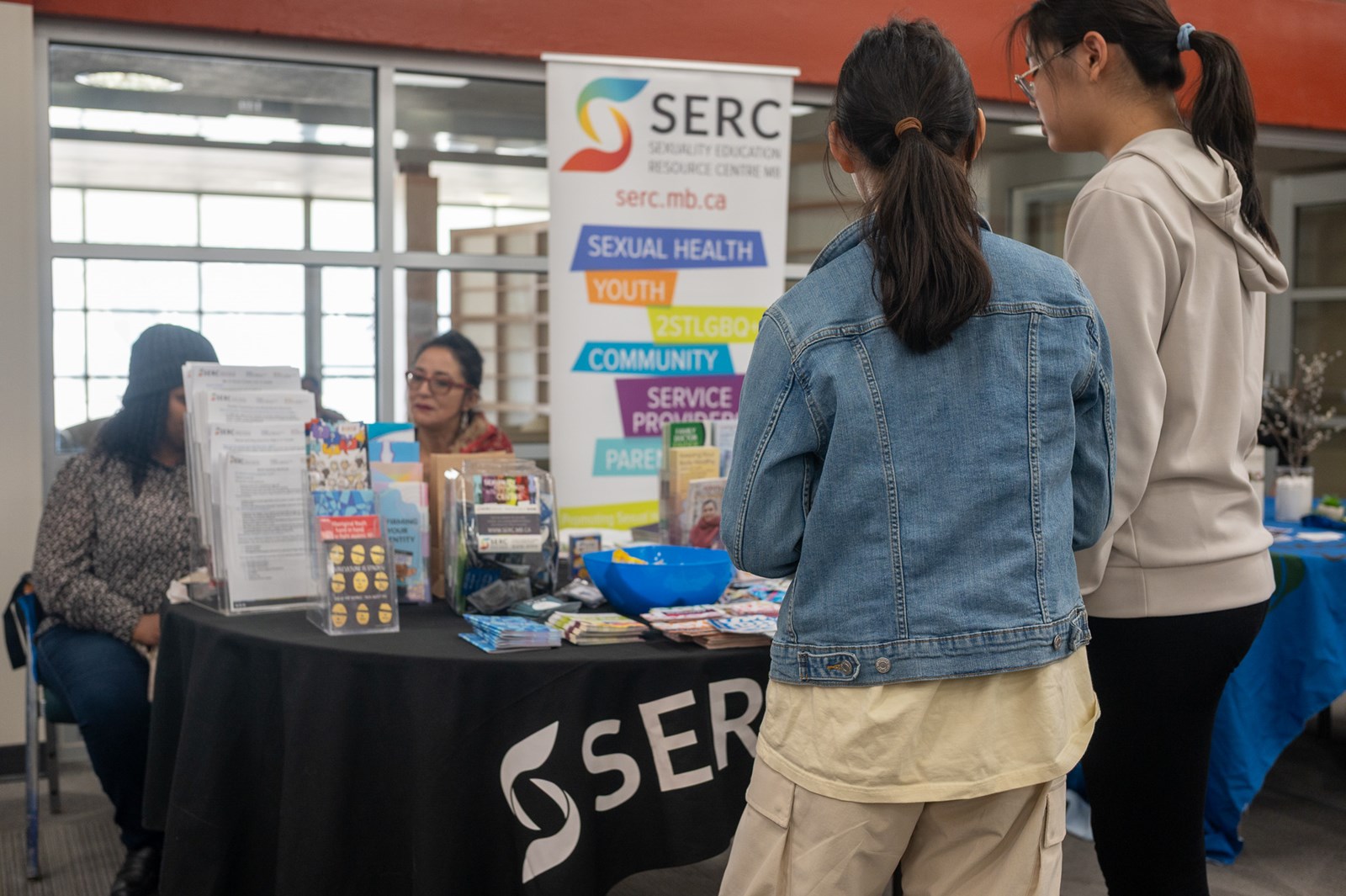 Two young people at wellness fair table