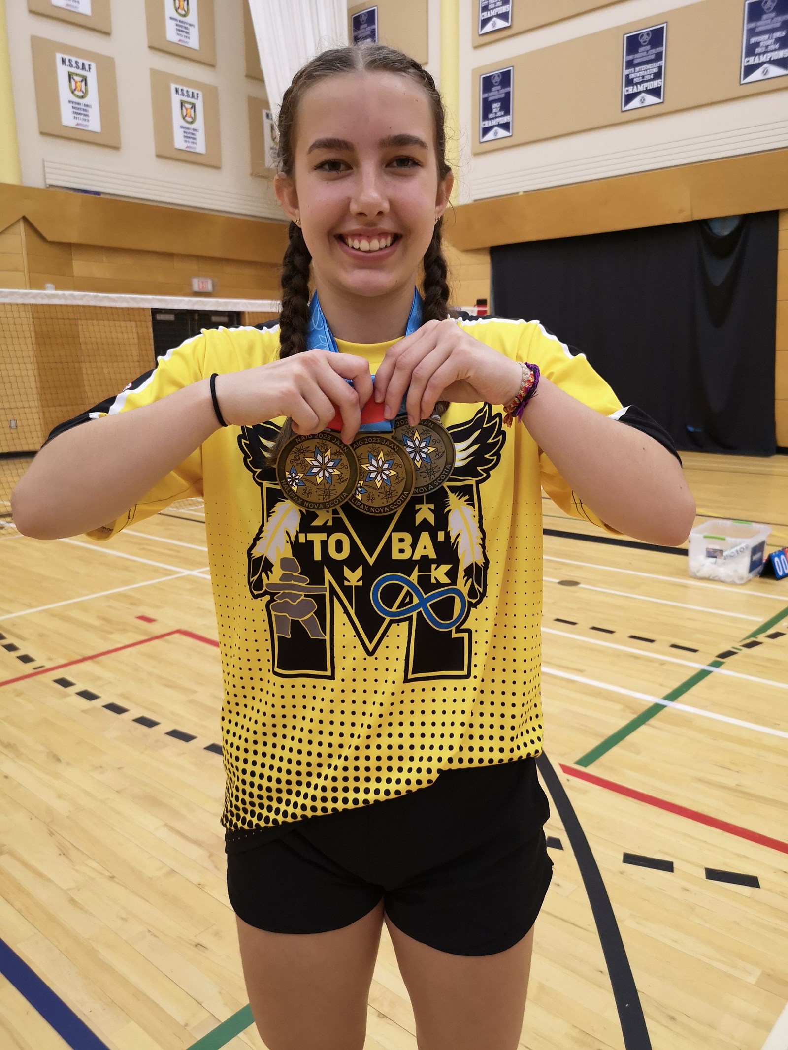 Rylee showing off her three medals