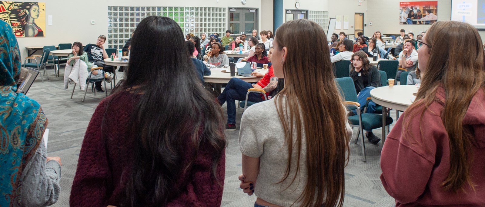 A diverse group of students in a meeting