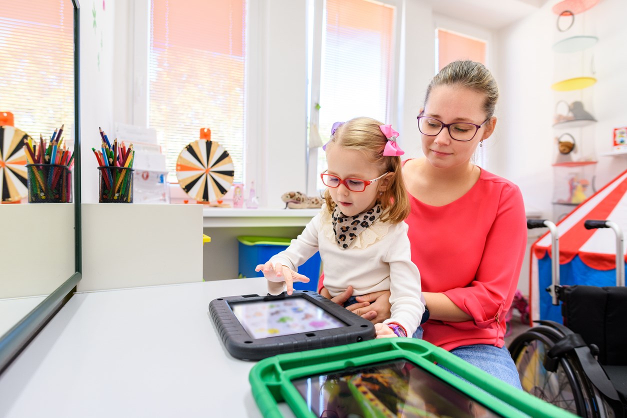 Child using AAC device
