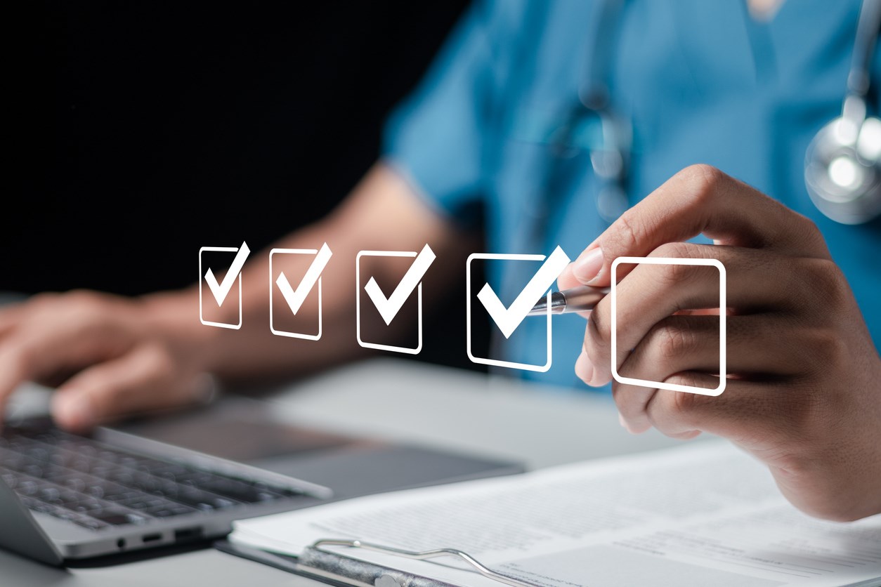 Image/graphic combo, person on computer, making checkmarks in floating boxes