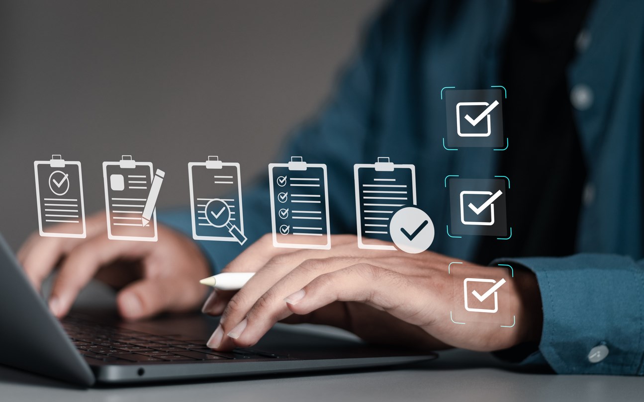 stock image person on computer with clipboard graphics overlaid