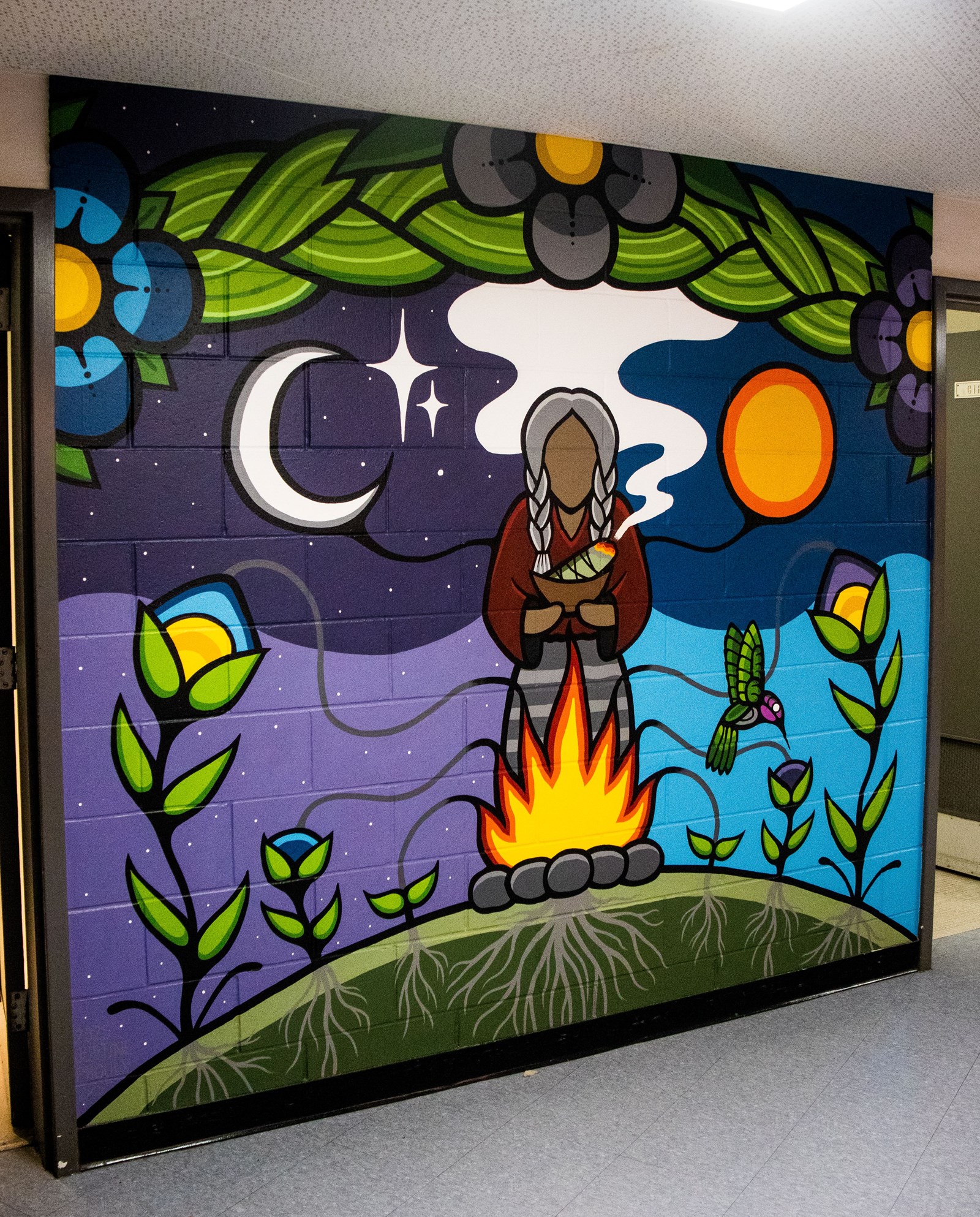 Mural between WPC's main bathrooms representing a matriach figure