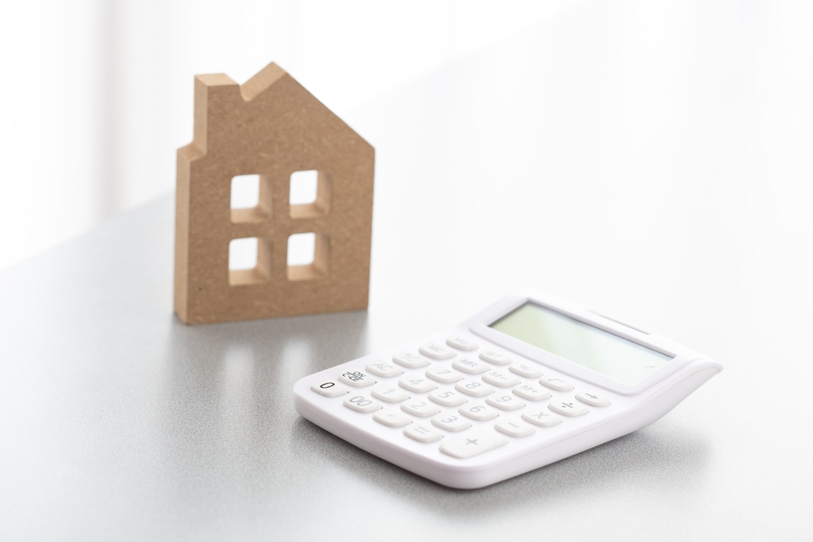 Miniature house and calculator