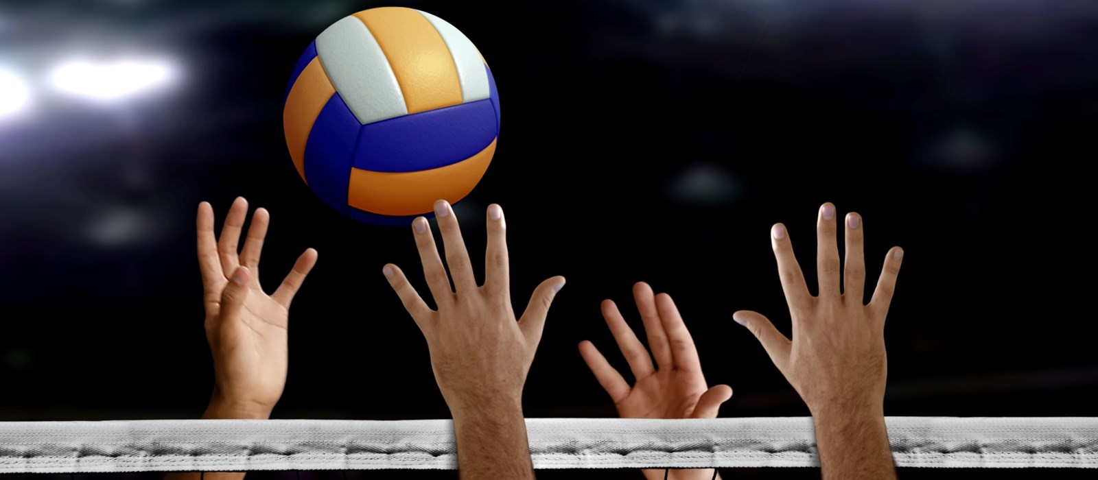 Hands reaching above a net for a volleyball