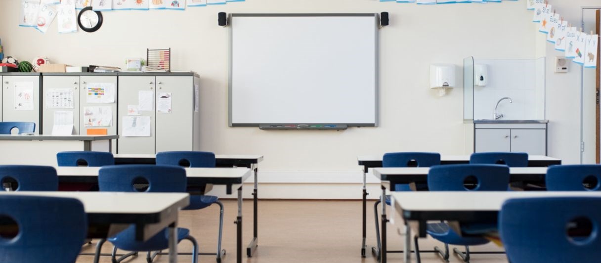 Empty classroom with whiteboard stock photo